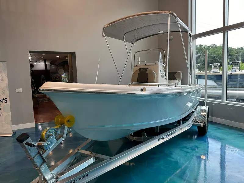 Slide: The Image of 2025 Key West 1720 Center Console boat on display in showroom. - 1