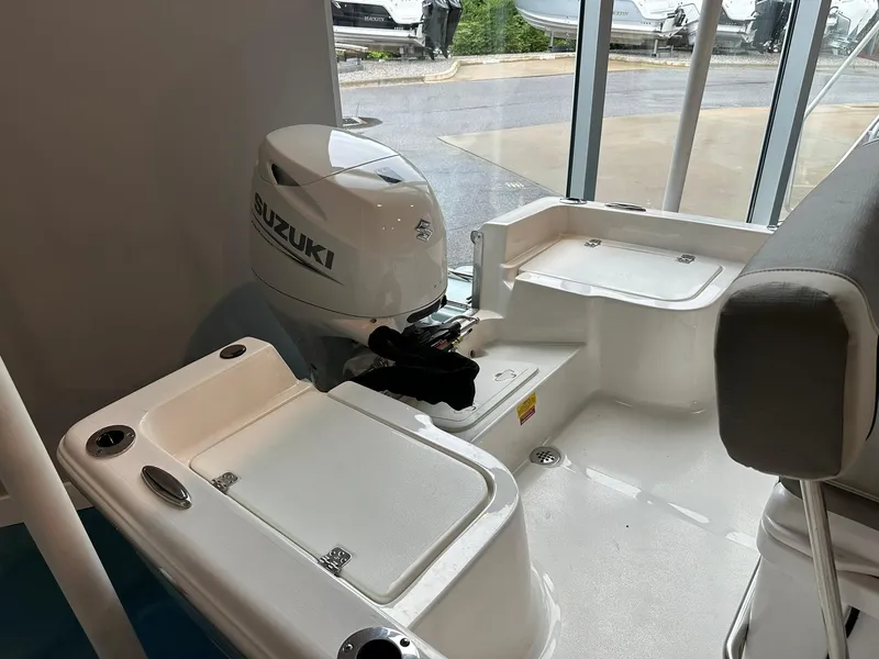 Slide: The Image of 2025 Key West 1720 Center Console boat interior with Suzuki outboard motor. - 11