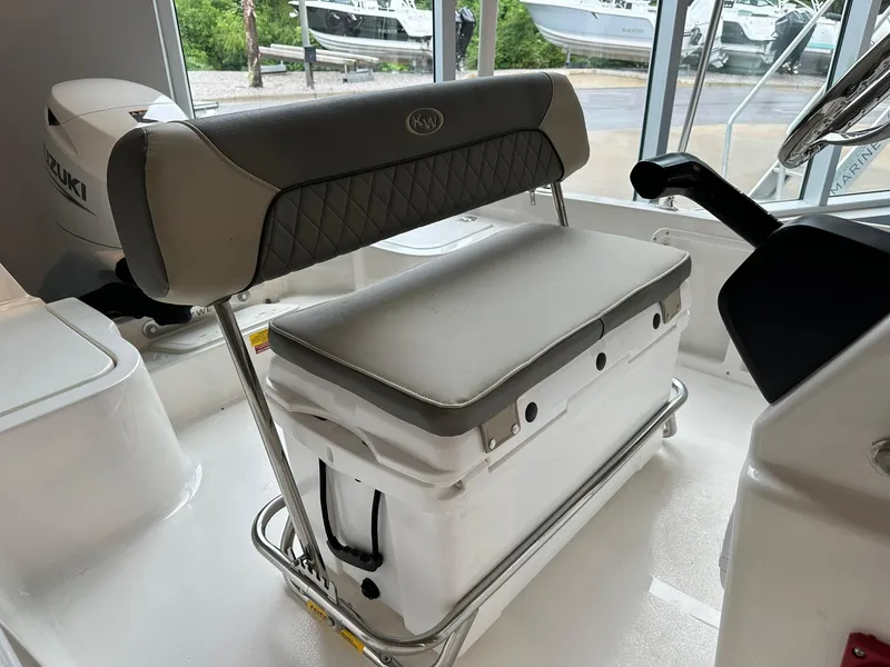 Slide: The Image of 2025 Key West 1720 Center Console boat interior with cushioned seating and storage. - 7