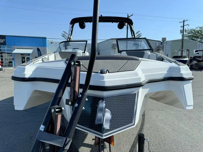 Slide: The Image of 2021 Heyday WT-2 boat, front view, parked outdoors on a sunny day. - 2