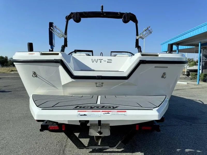 Slide: The Image of 2021 Heyday WT-2 boat rear view, parked outdoors on a sunny day. - 20
