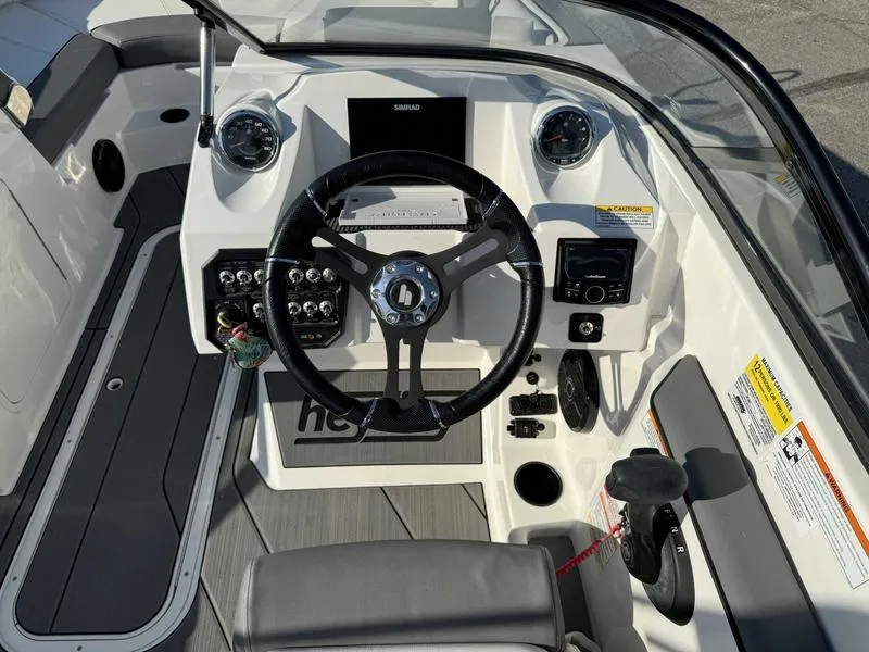 Slide: The Image of 2021 Heyday WT-2 boat dashboard with steering wheel and control panel. - 25
