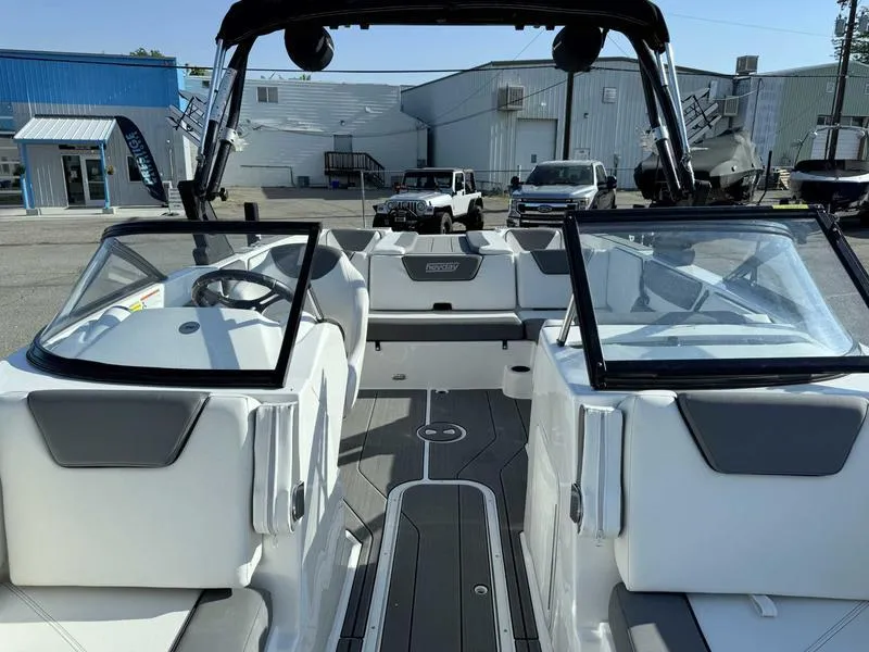 Slide: The Image of 2021 Heyday WT-2 boat interior with dual consoles and open seating area. - 27