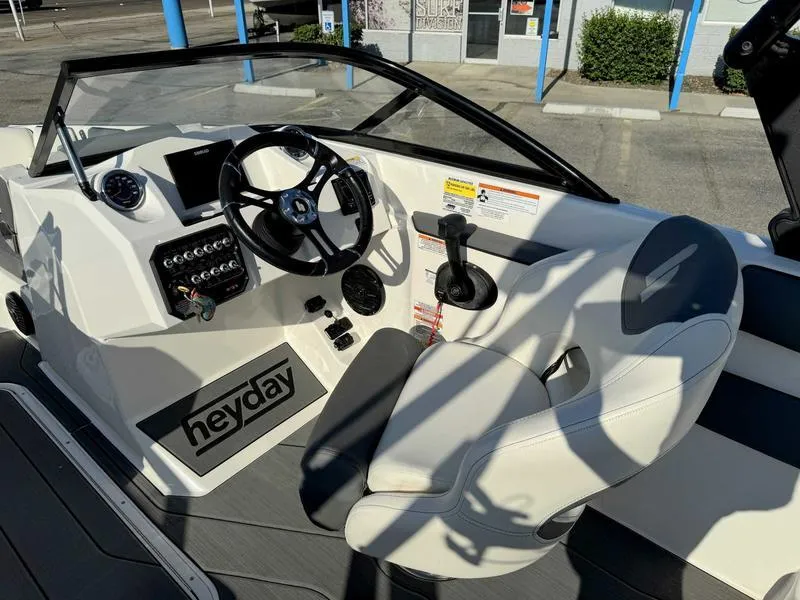 Slide: The Image of 2021 Heyday WT-2 boat interior with steering wheel and control panel. - 37