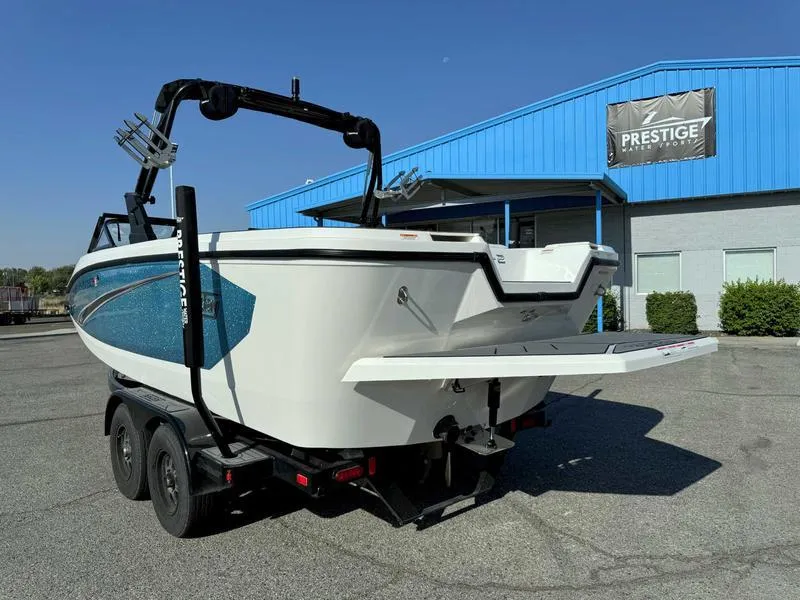 Slide: The Image of 2021 Heyday WT-2 boat on trailer, parked outside a blue building. - 5