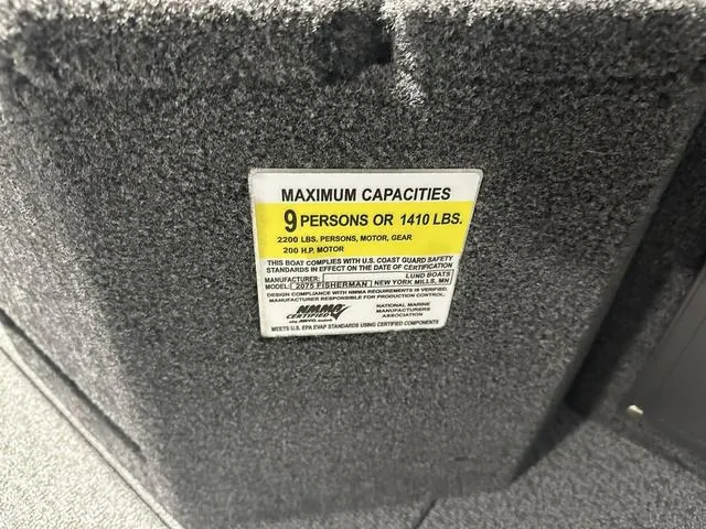Slide: The Image of Capacity label on 2025 Lund 2075 Fisherman Sport boat, maximum 9 persons or 1410 lbs. - 18