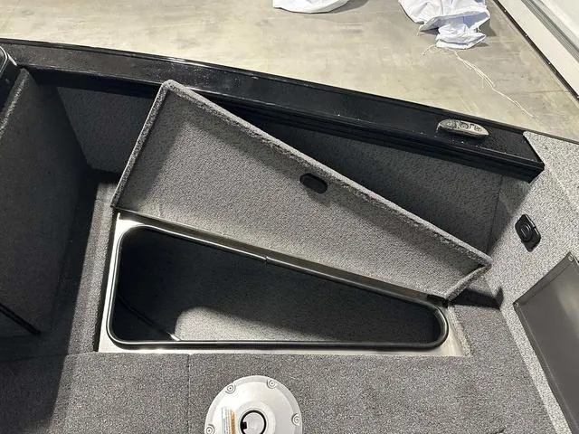 Slide: The Image of Open storage compartment in 2025 Lund 2075 Fisherman Sport boat. - 22