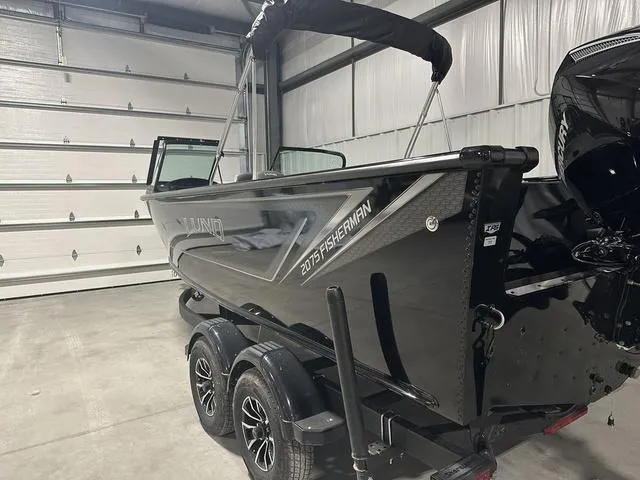 Slide: The Image of 2025 Lund 2075 Fisherman Sport boat in a garage, side view. - 6