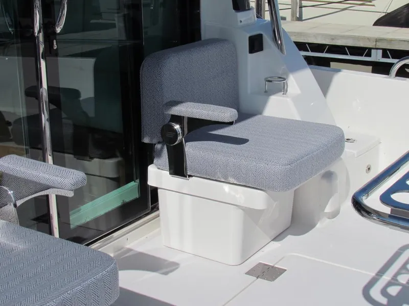 Slide: The Image of 2025 Sabre 43 Salon Express boat seat with gray upholstery and modern design. - 12