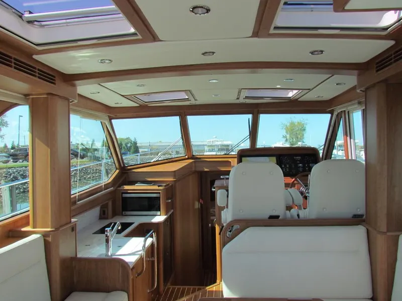 Slide: The Image of Interior of 2025 Sabre 43 Salon Express yacht with modern amenities and panoramic windows. - 15