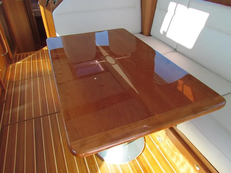 Slide: The Image of Polished wooden table in 2025 Sabre 43 Salon Express yacht interior. - 17