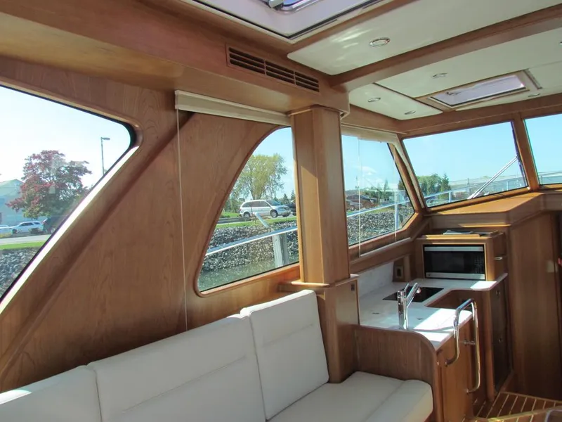 Slide: The Image of Interior of 2025 Sabre 43 Salon Express yacht with modern kitchen and seating area. - 21