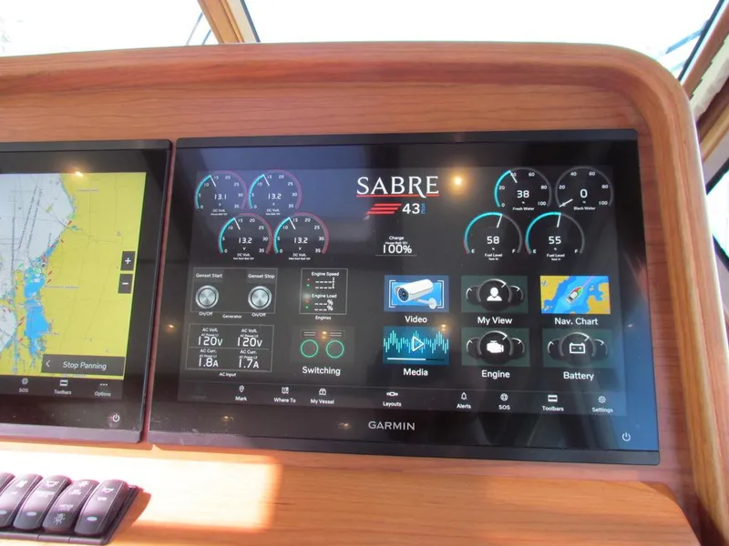 Slide: The Image of Dashboard of 2025 Sabre 43 Salon Express with Garmin navigation display. - 29