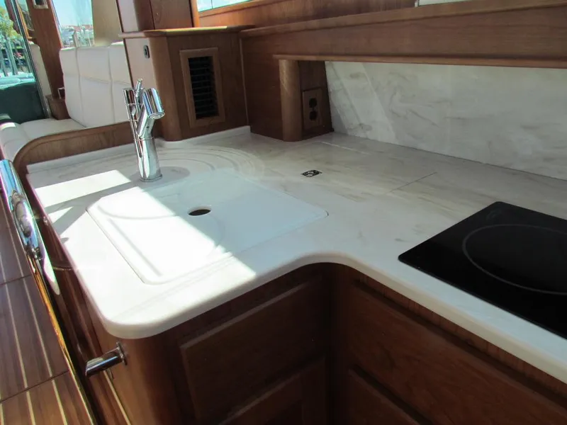 Slide: The Image of Modern kitchen interior of 2025 Sabre 43 Salon Express yacht with sleek countertops. - 30