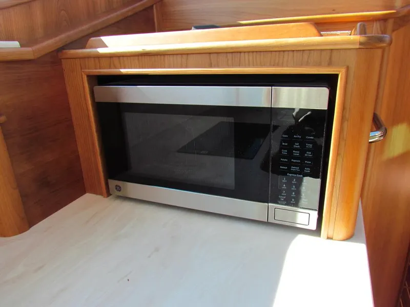Slide: The Image of Built-in microwave in 2025 Sabre 43 Salon Express yacht kitchen. - 32