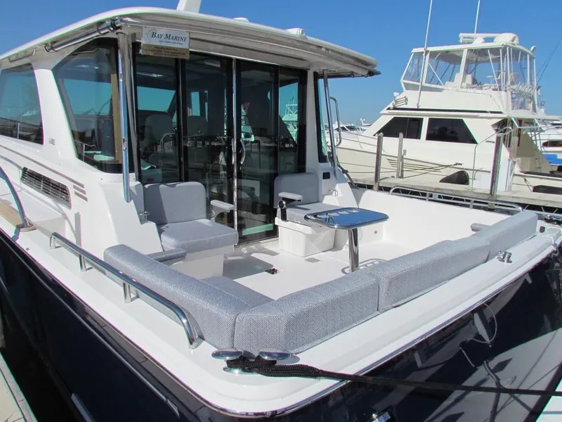 Slide: The Image of 2025 Sabre 43 Salon Express yacht with spacious deck and seating area. - 44