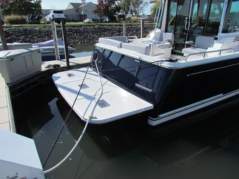 Slide: The Image of 2025 Sabre 43 Salon Express yacht docked at marina. - 47