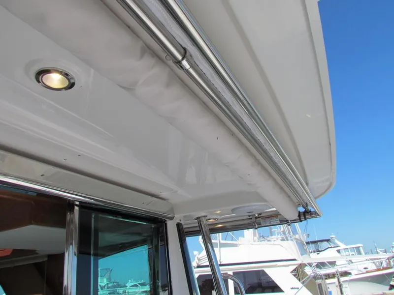 Slide: The Image of 2025 Sabre 43 Salon Express yacht exterior with chrome details and marina view. - 48