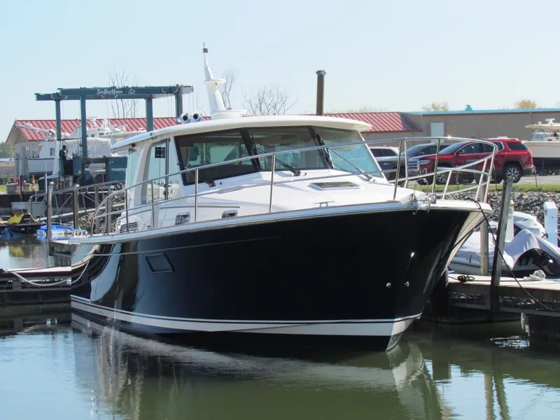 Slide: The Image of 2025 Sabre 43 Salon Express yacht docked in marina. - 52