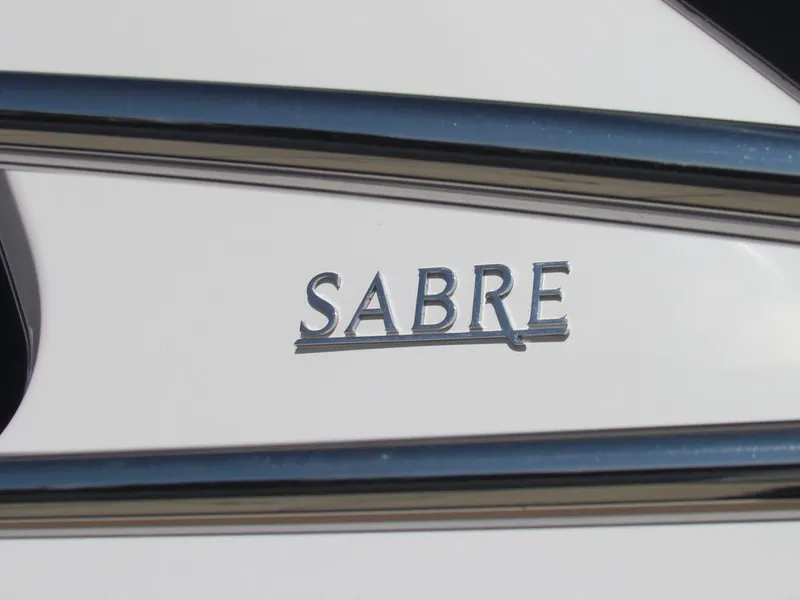 Slide: The Image of Close-up of 2025 Sabre 43 Salon Express logo on white surface. - 62