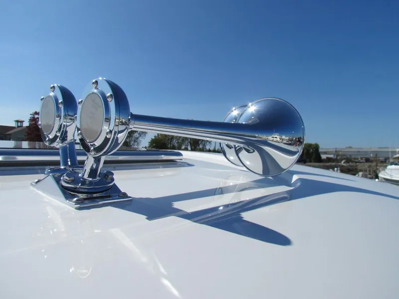 Slide: The Image of Chrome horn on 2025 Sabre 43 Salon Express yacht, reflecting sunlight. - 63