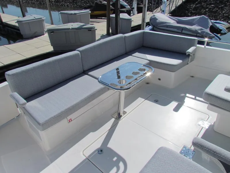 Slide: The Image of 2025 Sabre 43 Salon Express yacht with sleek seating and modern table design. - 9
