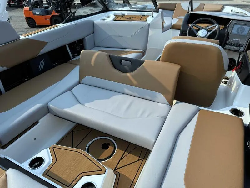 Slide: The Image of 2023 ATX Surf Boats 20 Type-S interior with tan and white seating. - 16