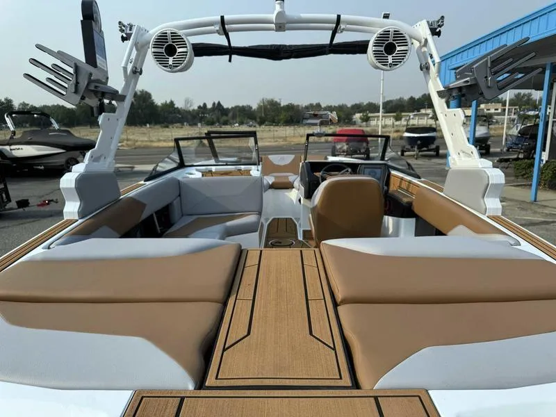 Slide: The Image of 2023 ATX Surf Boats 20 Type-S interior with tan and white seating, open-air design. - 8