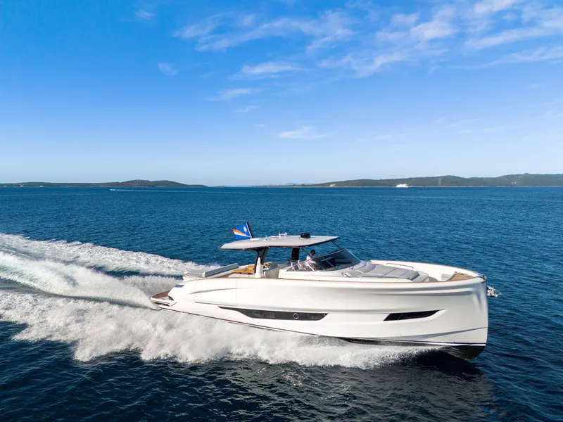 The Image of 2025 Solaris Power 60 Open yacht cruising on open sea under clear blue sky. - 0