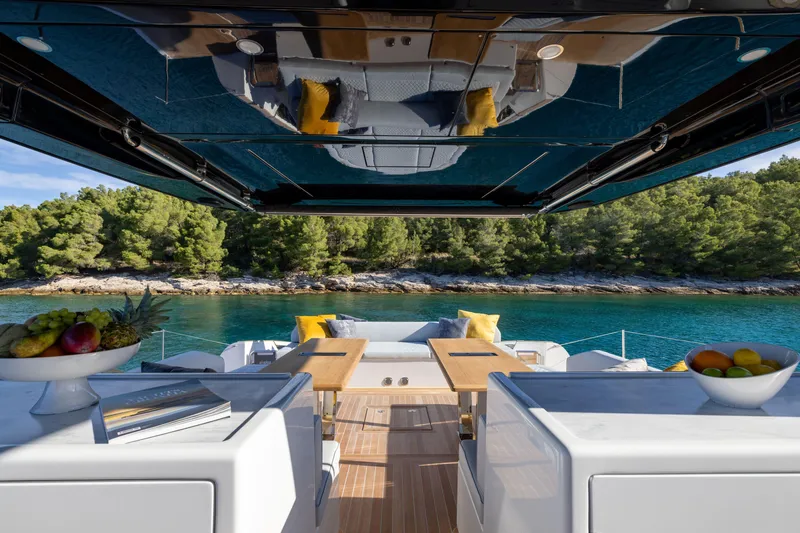 Slide: The Image of Luxurious 2025 Solaris Power 60 Open yacht interior with scenic waterfront view. - 14