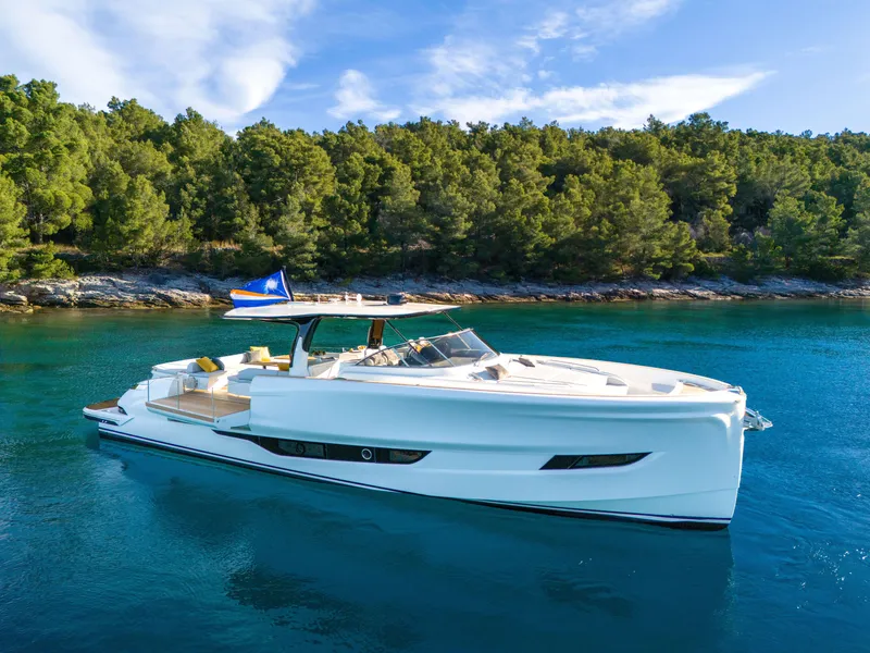 Slide: The Image of Luxurious 2025 Solaris Power 60 Open yacht cruising in serene blue waters. - 22
