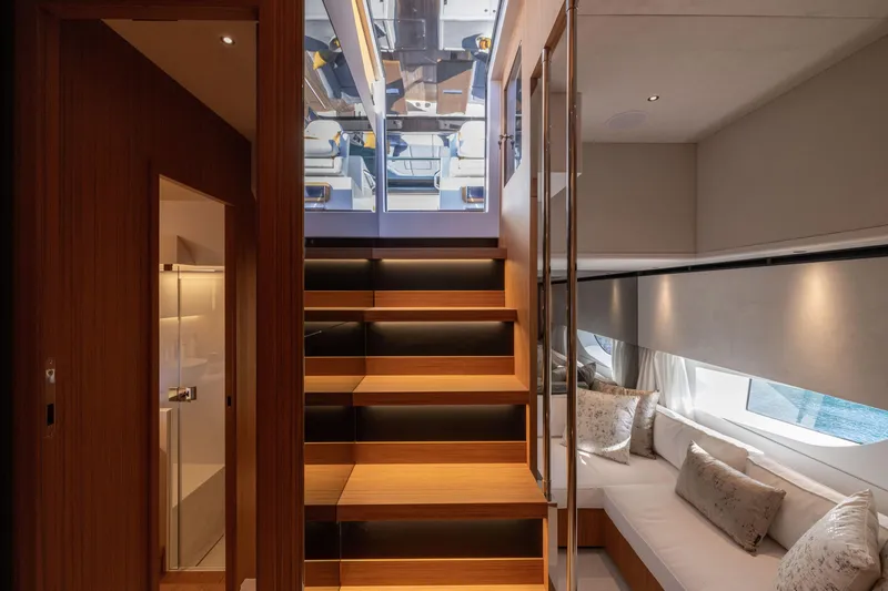 Slide: The Image of Luxurious interior of 2025 Solaris Power 60 Open yacht with modern staircase and cozy seating area. - 46