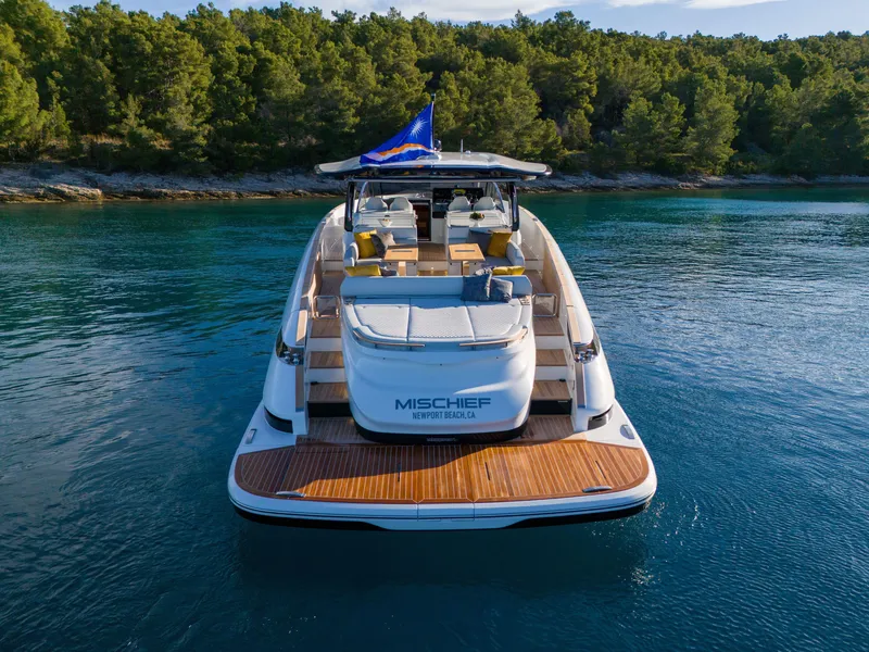 Slide: The Image of 2025 Solaris Power 60 Open yacht on serene water, rear view. - 6