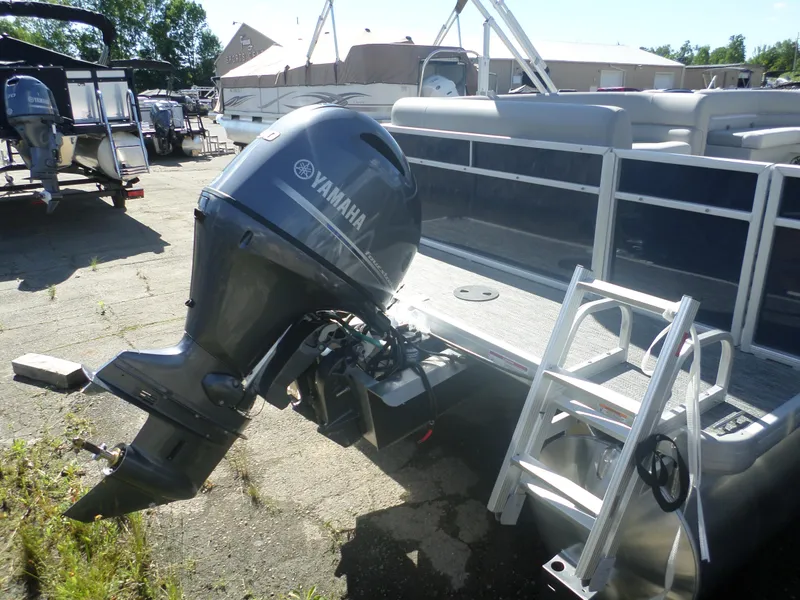 Slide: The Image of 2025 Godfrey 2086 EXC pontoon boat with Yamaha outboard motor and boarding ladder. - 4