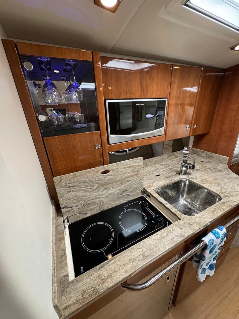 Slide: The Image of Modern kitchen in 2018 Formula 34 PC yacht with stove, sink, and microwave. - 19