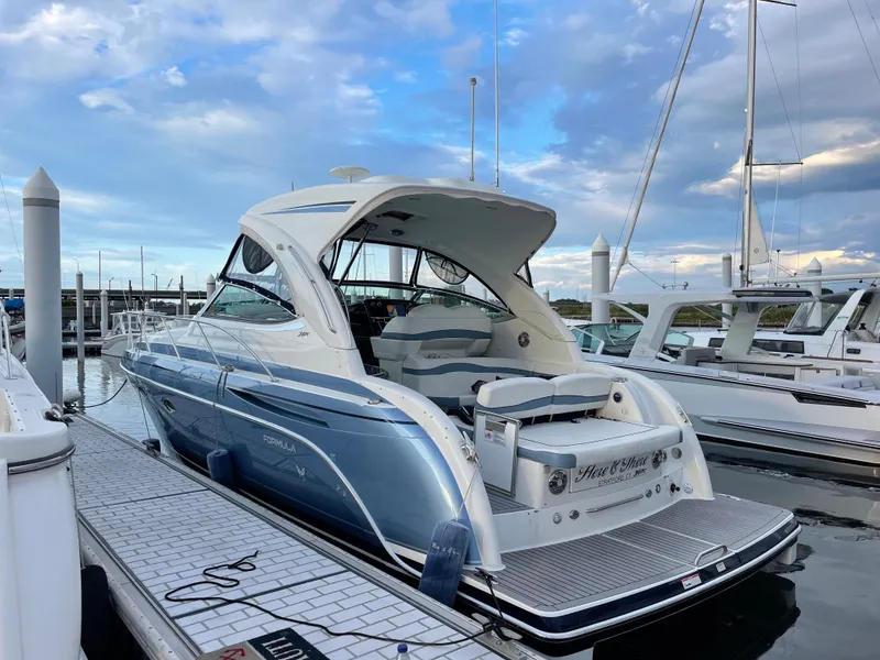 Slide: The Image of 2018 Formula 34 PC yacht docked at marina under blue sky. - 2