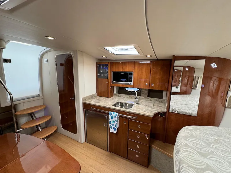 Slide: The Image of Interior of 2018 Formula 34 PC yacht with kitchen, wooden cabinetry, and modern amenities. - 21