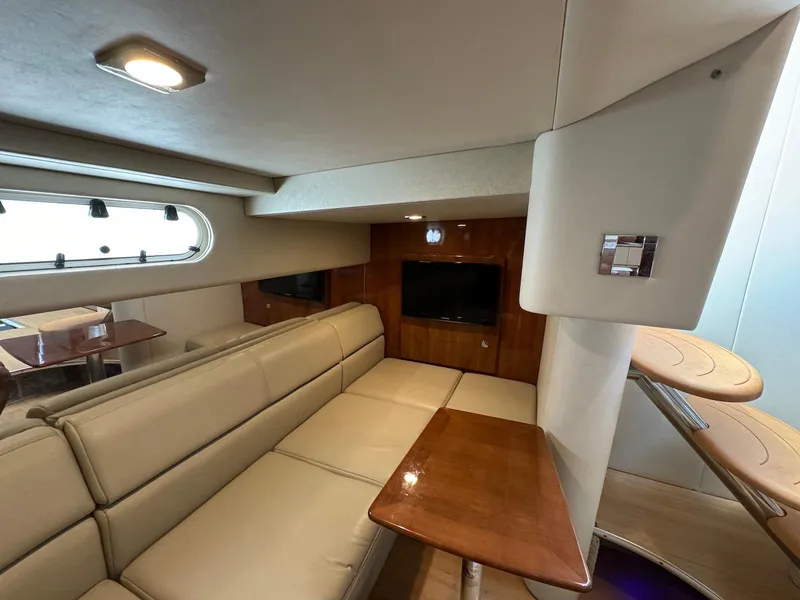 Slide: The Image of 2018 Formula 34 PC yacht interior with beige seating and wooden accents. - 30