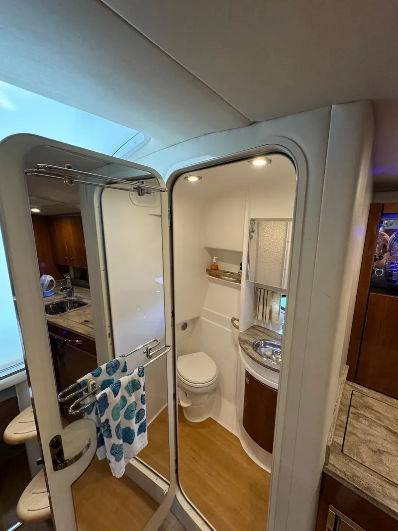 Slide: The Image of 2018 Formula 34 PC yacht bathroom with modern fixtures and wooden accents. - 32