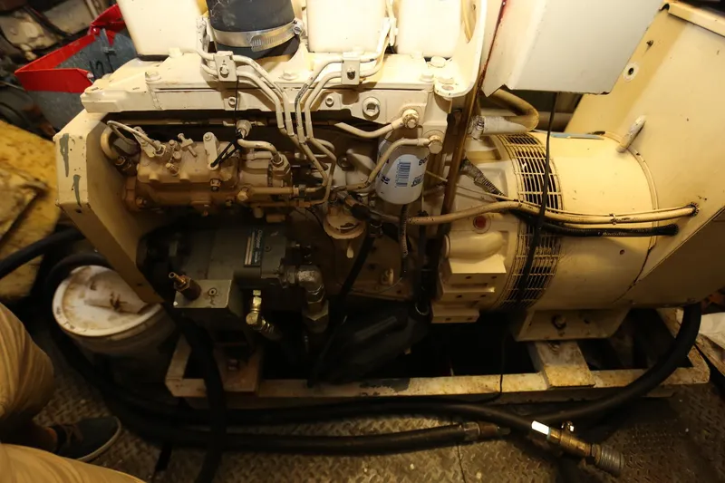 Slide: The Image of Engine room of 1988 Winston Knauss 64 Dinner or Party Boat, showcasing mechanical components. - 12