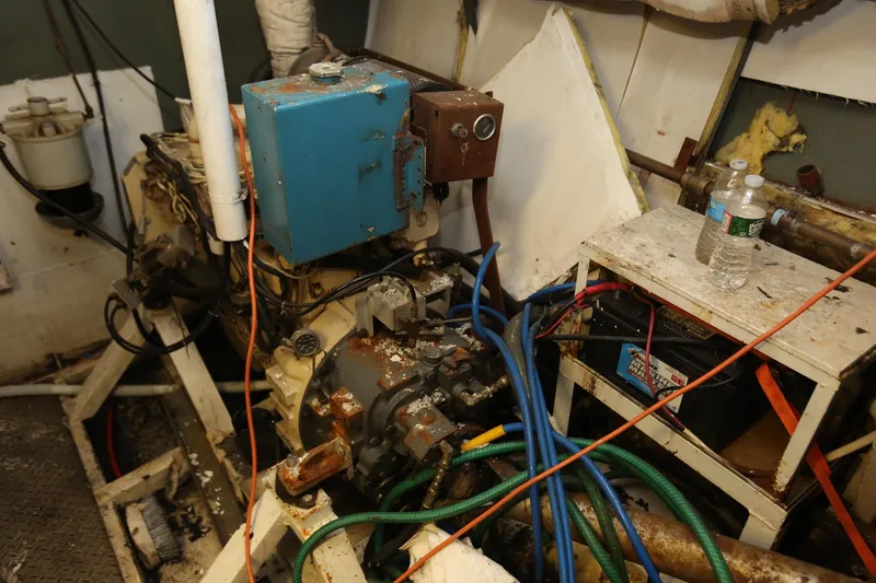 Slide: The Image of Engine room of 1988 Winston Knauss 64 party boat, showing machinery and cables. - 15