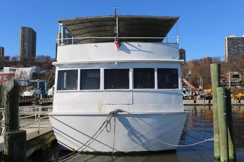 Slide: The Image of 1988 Winston Knauss 64 Dinner or Party Boat docked in urban marina. - 3