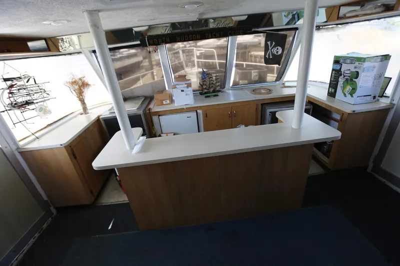 Slide: The Image of Interior of 1988 Winston Knauss 64 party boat with bar and cabinets. - 31