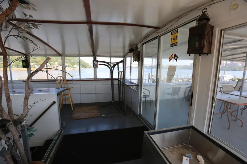 Slide: The Image of Interior of 1988 Winston Knauss 64 party boat with seating and river view. - 36