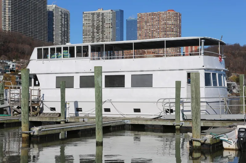 Slide: The Image of Custom 1988 Winston Knauss 64 dinner or party boat docked in urban marina. - 5