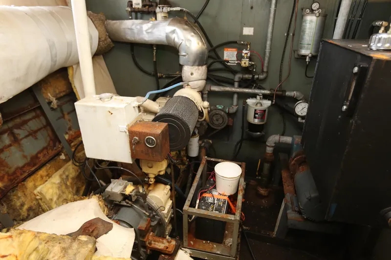 Slide: The Image of Engine room of 1988 Winston Knauss 64 Dinner or Party Boat, showcasing mechanical components. - 9