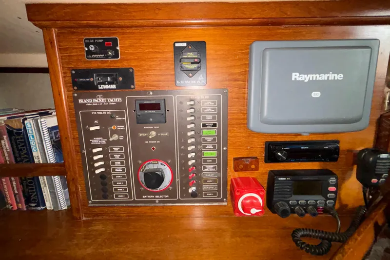 Slide: The Image of Control panel of a 1987 Island Packet 38 sailboat with navigation and communication equipment. - 23