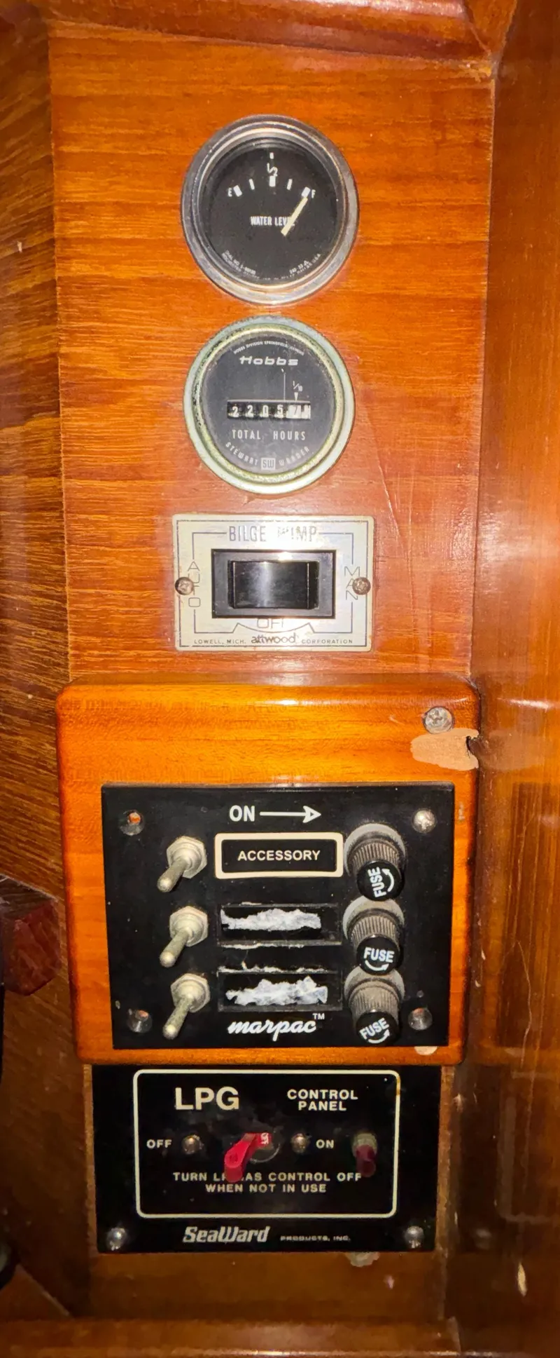 Slide: The Image of Control panel of a 1987 Island Packet 38 sailboat with gauges and switches. - 24