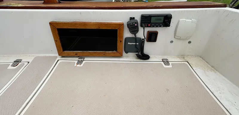 Slide: The Image of Control panel of a 1987 Island Packet 38 sailboat with radio equipment. - 38