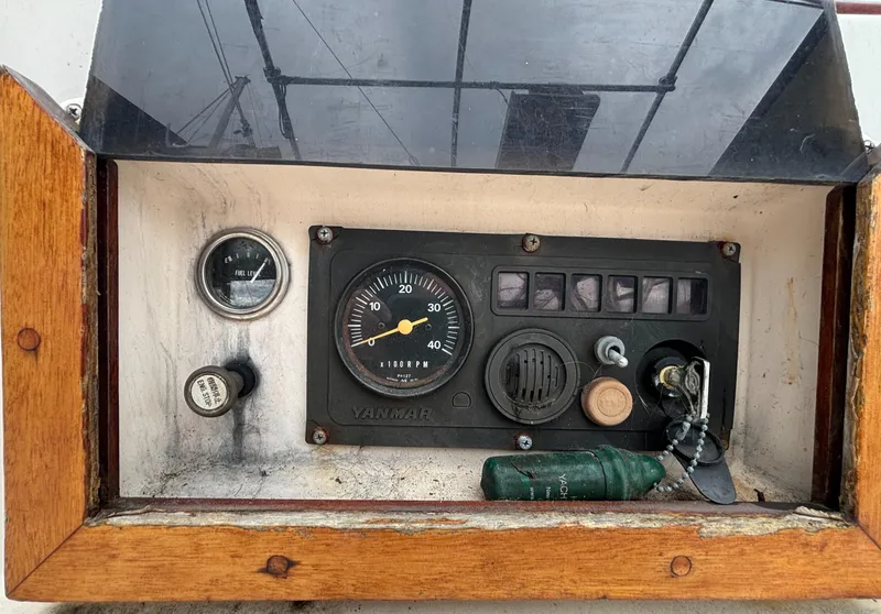 Slide: The Image of Control panel of a 1987 Island Packet 38 sailboat with gauges and switches. - 40